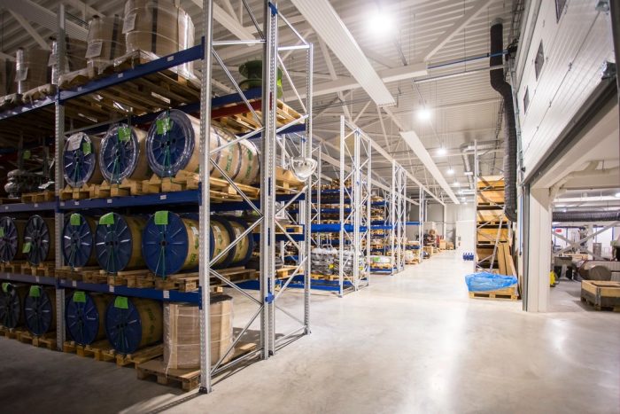 Interior of a warehouse with pallet racking and stacked goods